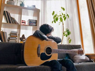 C minor chord on guitar, c minor guitar, cm on guitar, boy holding an acoustic guitar