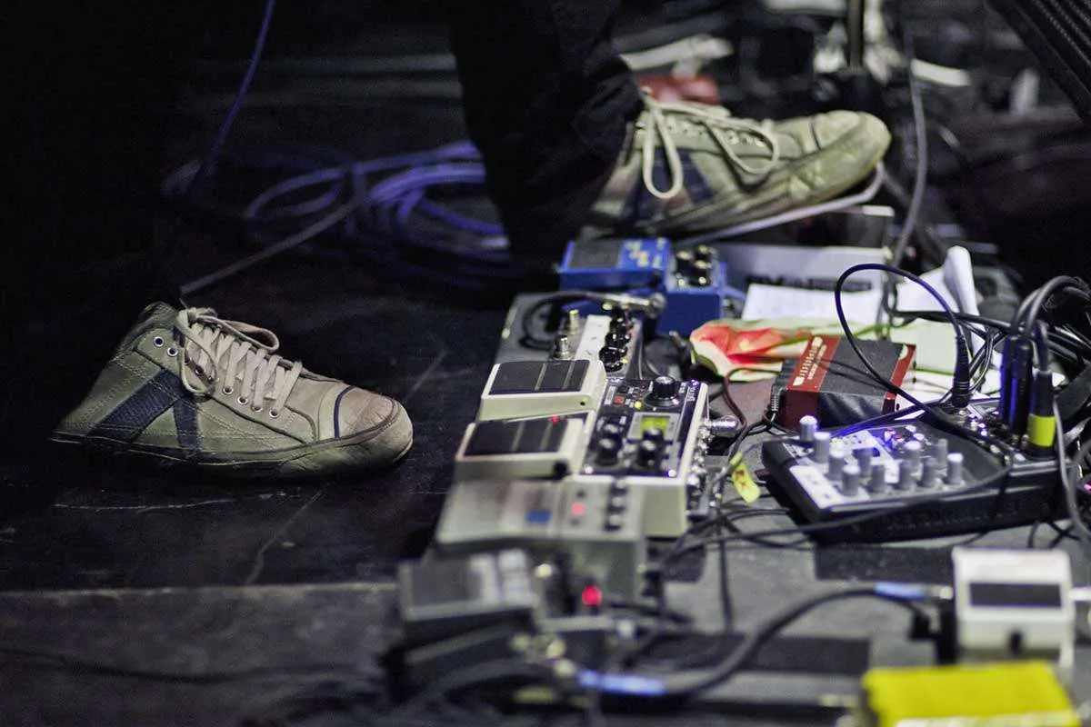 Understanding the nuances of pedal stacking, noise management, and amp settings is crucial