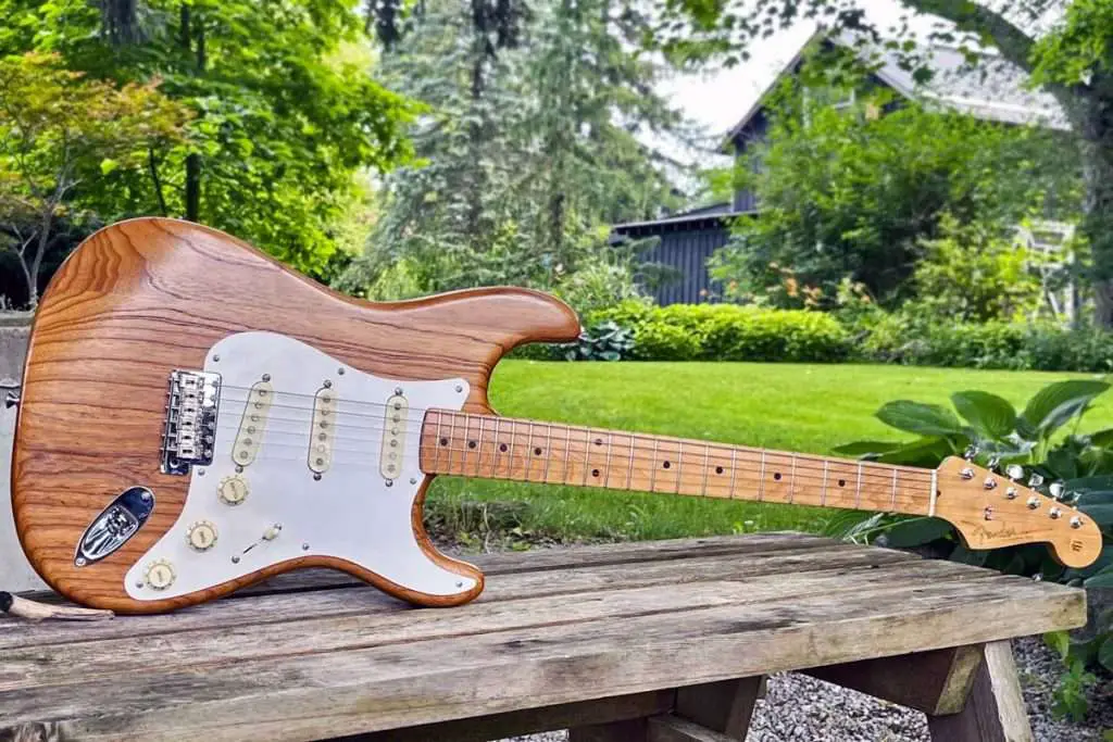 A stratocaster body, with its distinct double-cutaway shape and rounded edges, Dimensions of a Stratocaster Body measure approximately 12 inches wide and 16 inches long, with a thickness of about 1.75 inches