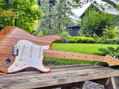 A stratocaster body, with its distinct double-cutaway shape and rounded edges, Dimensions of a Stratocaster Body measure approximately 12 inches wide and 16 inches long, with a thickness of about 1.75 inches